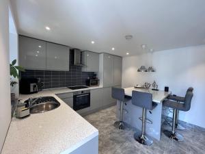 a kitchen with a sink and a counter top at Westcliff-on-Sea Coach house in Westcliff On Sea