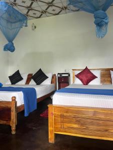 Postel nebo postele na pokoji v ubytování Himansa Homestay