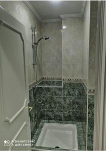 a bathroom with a shower with a toilet in it at appartement julia au centre ville agadir dans résidence borj dalat in Agadir