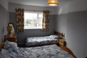 Кровать или кровати в номере Withern Mill Trout Farm