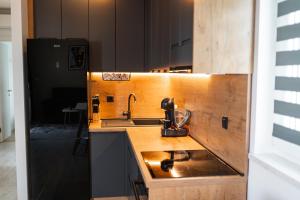 a kitchen with a sink and a counter top at Apartment Natali in Split