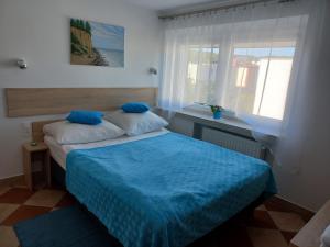 Postel nebo postele na pokoji v ubytování Dom Gościnny Raido + 6 fotografií