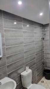 Ένα μπάνιο στο Appartement Taza