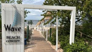 a walkway to the beach with a beach concept sign at Crest View 777th - Apartament & SPA in Międzyzdroje