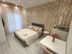 Postel nebo postele na pokoji v ubytování BlancoHouse - Nido d'amore sul Parco