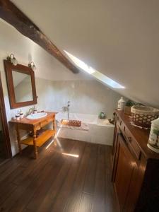 a bathroom with a sink and a bath tub at Maison en bord de mer en Corse Lavasina Brando in Brando
