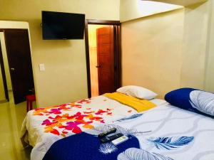 Hotel familiar Doña Nida tesisinde bir odada yatak veya yataklar