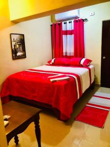 Katil atau katil-katil dalam bilik di Hotel familiar Doña Nida