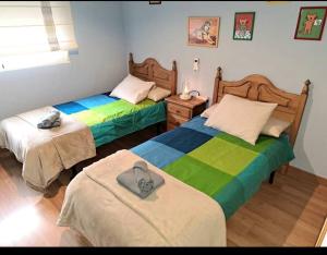 Un pat sau paturi într-o cameră la Casa rural Brisa de Toledo
