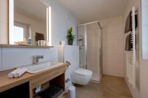 Koupelna v ubytování Das Unterrain Lifestyle Hotel + 27 fotografií