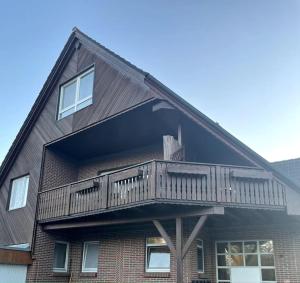 a house with a deck on the side of it at Schöne Ferienwohnungen -bis zu 4 Personen 70qm2- in Oldenburg Eversten in Oldenburg