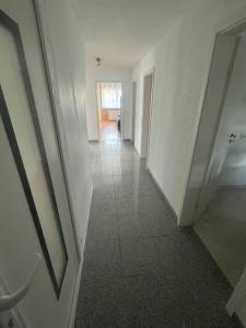 an empty hallway in a building with a hallway at Sunshine FeWo in Rust