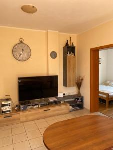 a living room with a large flat screen tv at Apartment Sun in Novalja