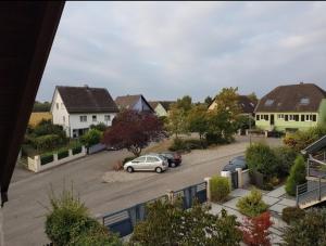 a car parked in a parking lot in a residential neighborhood at gite La Forêt in Ungersheim
