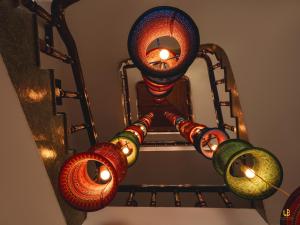 a group of colorful lights hanging from a ceiling at Le Boutique Sapa Hotel in Sapa +43 photos
