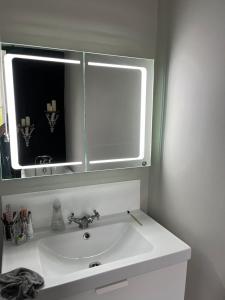 a bathroom with a sink and a mirror at Humphreston House in Temple Cloud