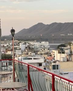 a view of a city from the balcony of a building at Hotel Mewari Villa in Udaipur