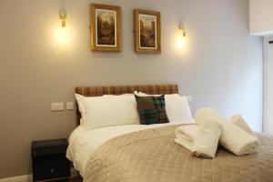 Postel nebo postele na pokoji v ubytování Conon Hotel