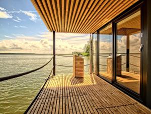 a wooden dock with a view of the water at Waterfront Loft in Brandenburg an der Havel
