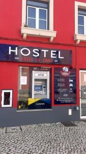 a red building with a sign for a hotel at Hostel Vasco Da Gama in Lagos