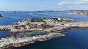 an aerial view of a house on an island in the water at Lauvøy Feriesenter in Askøy
