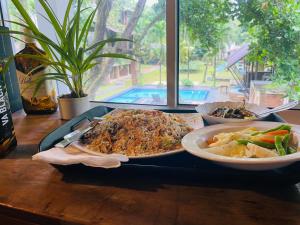 a tray with two plates of food on a table at The Shade Brothers in Katunayaka