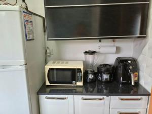 Minicasa Show, 27m², com churrasqueira e varanda!的厨房或小厨房