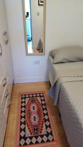 Minicasa Show, 27m², com churrasqueira e varanda!客房内的一张或多张床位