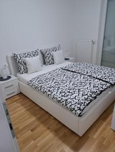 Ένα ή περισσότερα κρεβάτια σε δωμάτιο στο Apartman San