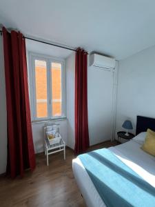 a bedroom with a bed and a window with red curtains at Charming Navona in Rome
