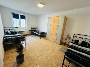a room with two beds and a couch in a room at Monteur Home in Solingen