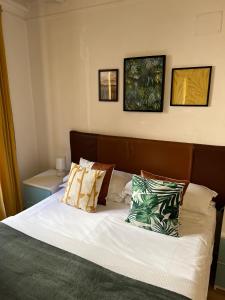 a bedroom with a bed with white sheets and pillows at Charming Navona in Rome
