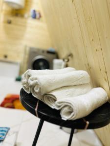 a pile of towels sitting on top of a table at Phaliani's Heaven in Mestia +59 photos