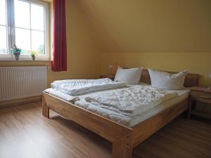 Ένα ή περισσότερα κρεβάτια σε δωμάτιο στο Ferienhaus Sandra