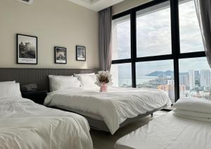 Postel nebo postele na pokoji v ubytování DD Condominium 2Bedroom Sea view Georgetown Penang