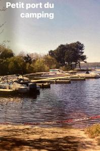 a group of boats are docked on a lake at mobil home jordy a gastes 714 in Gastes