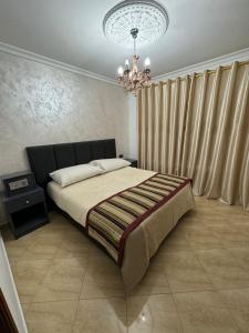 Ένα ή περισσότερα κρεβάτια σε δωμάτιο στο Appart Hotel Excellent