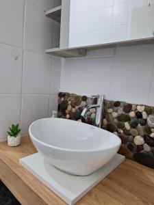 a white bowl sink on a counter in a bathroom at VP in Bajina Bašta