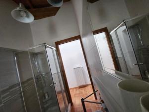 a bathroom with a shower and a glass shower stall at B&B Tussillo in Tussillo +24 photos