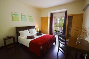 Кровать или кровати в номере Alentejo Star Hotel - Sao Domingos - Mertola - Duna Parque Group