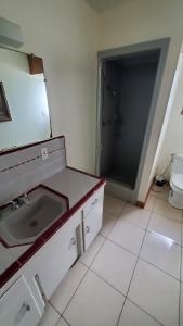 a bathroom with a sink and a toilet at Pearl Cove in Santa Cruz