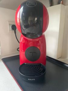 a red blender sitting on top of a counter at Mobil home 6-8pers - Le lac des rêves in Lattes