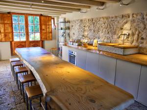 a kitchen with a wooden counter top in a room at Villa San Liberale - Suites & Wellness - Villa Veneta in Feltre