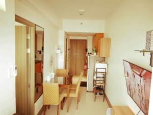 a kitchen and dining room with a table and chairs at The ICONIC: Comfortable living by Awsom Phil in Manila