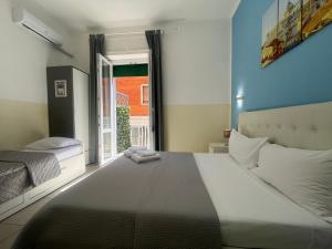 Postel nebo postele na pokoji v ubytování Hello Pisa B&B