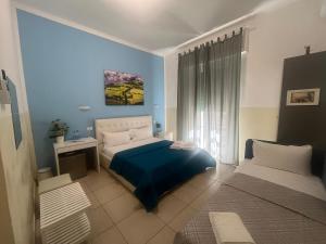 Postel nebo postele na pokoji v ubytování Hello Pisa B&B