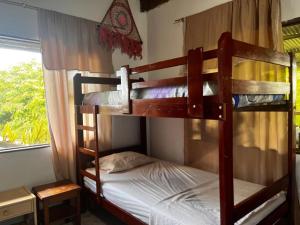 a couple of bunk beds in a room at Maiku Amazonas in Puerto Nariño