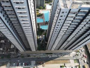 an overhead view of a tall white building at The ICONIC: Comfortable living by Awsom Phil in Manila