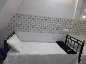A1 HOME STAY tesisinde bir odada yatak veya yataklar