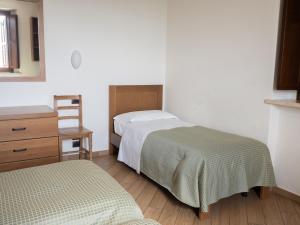 Postel nebo postele na pokoji v ubytování Domus Laetitiae Assisi + 37 fotografií